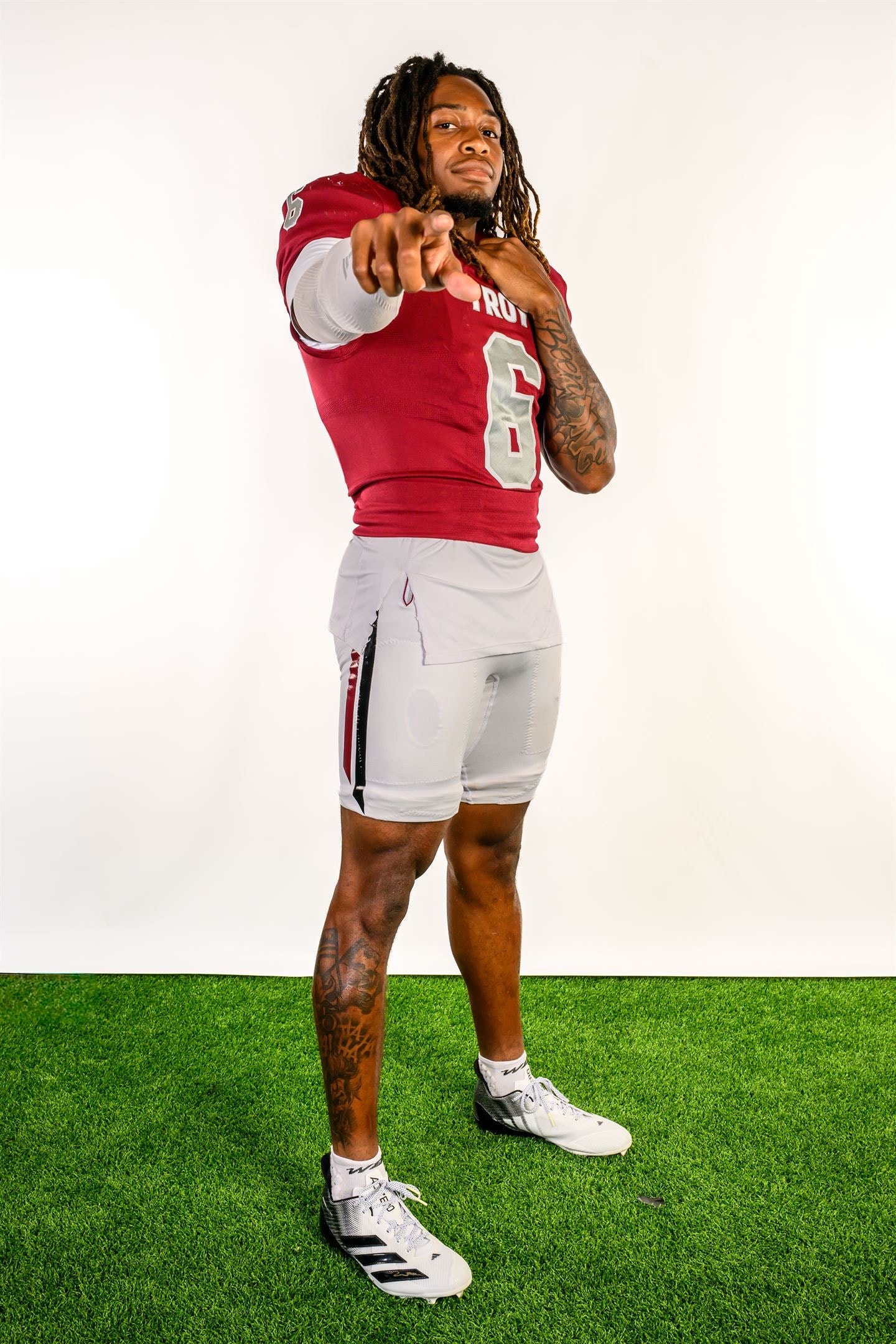 Justin Powe #06 — pointing at camera, Troy uniform