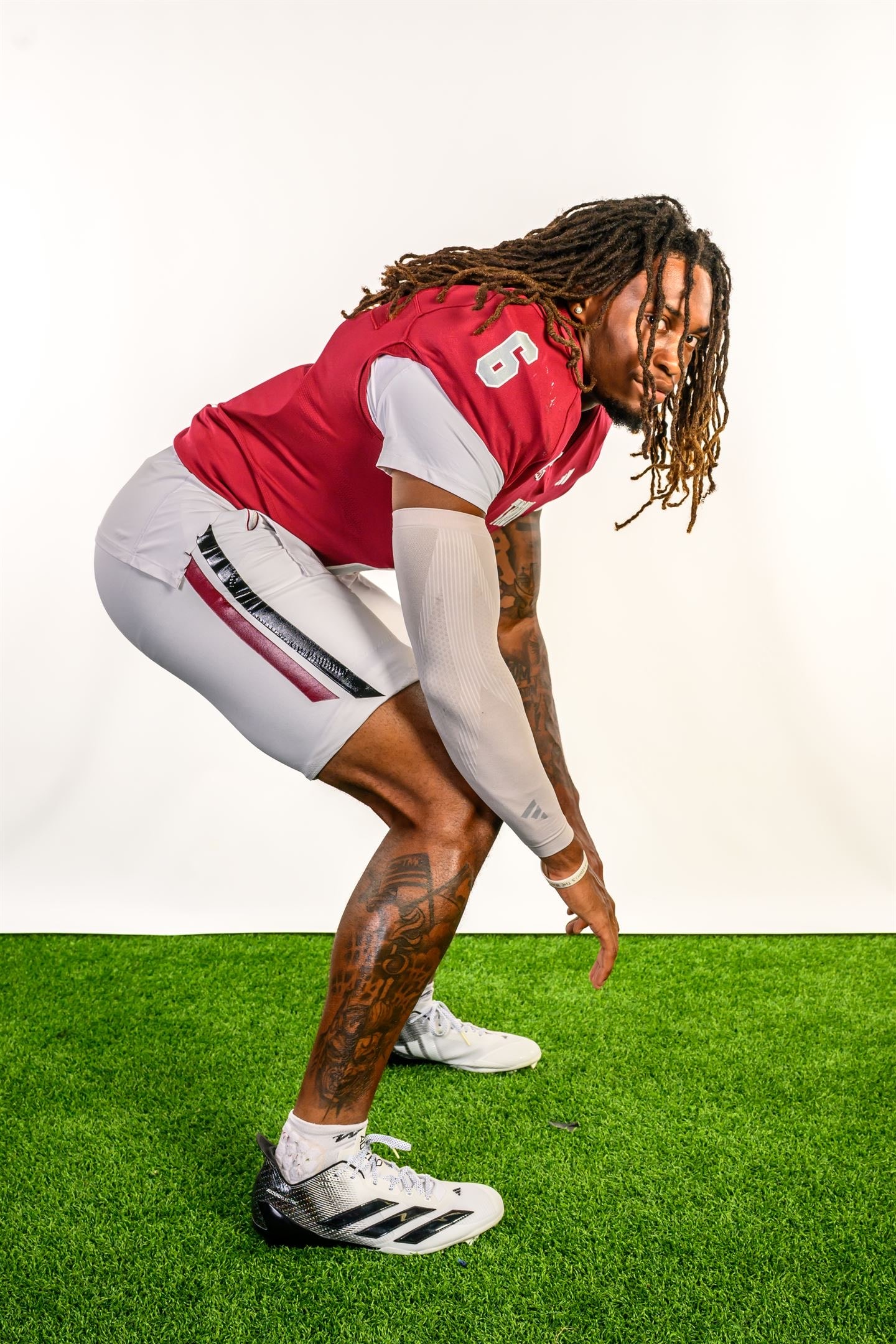 Justin Powe #06 — red uniform action pose