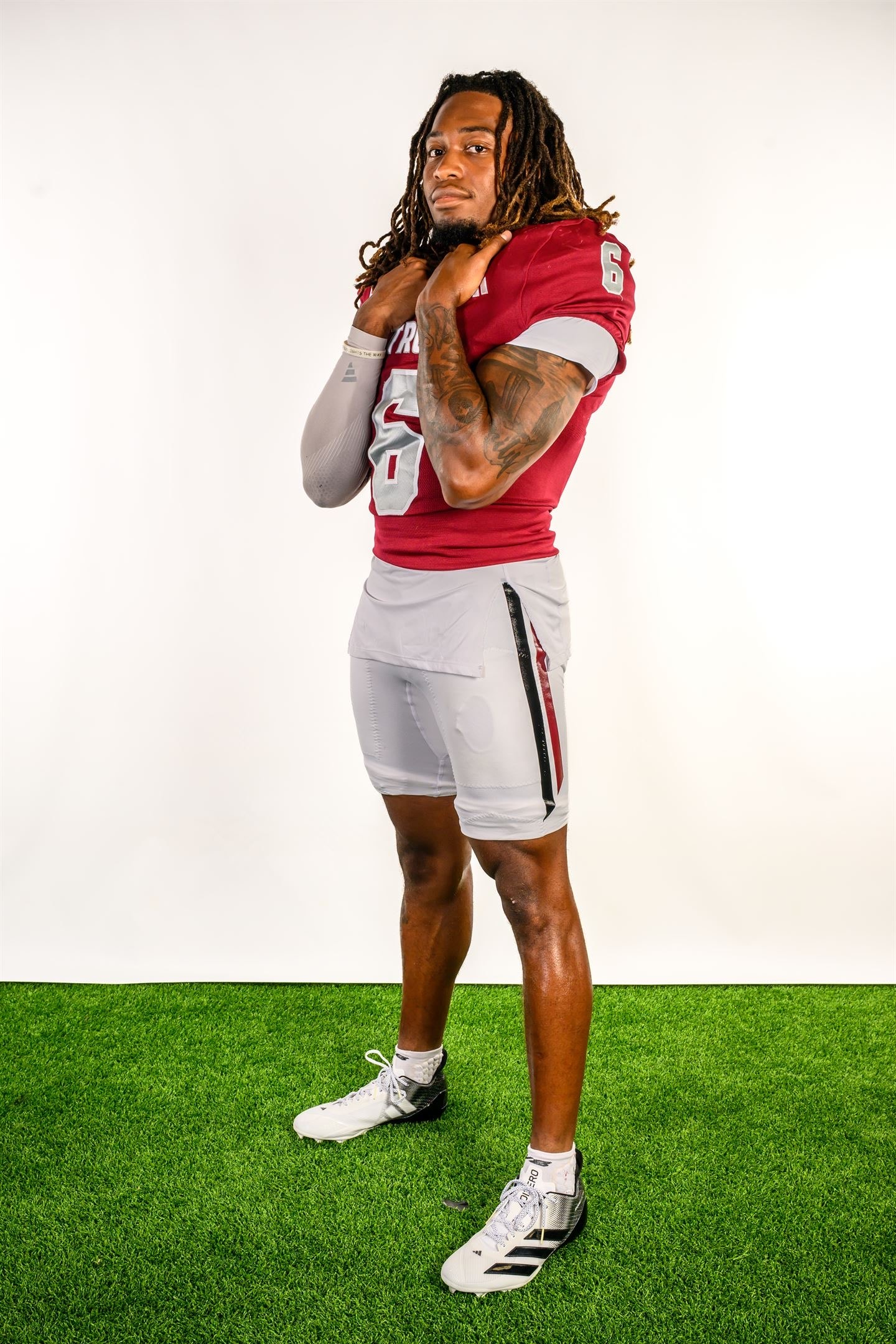 Justin Powe #06 — side pose, Troy uniform