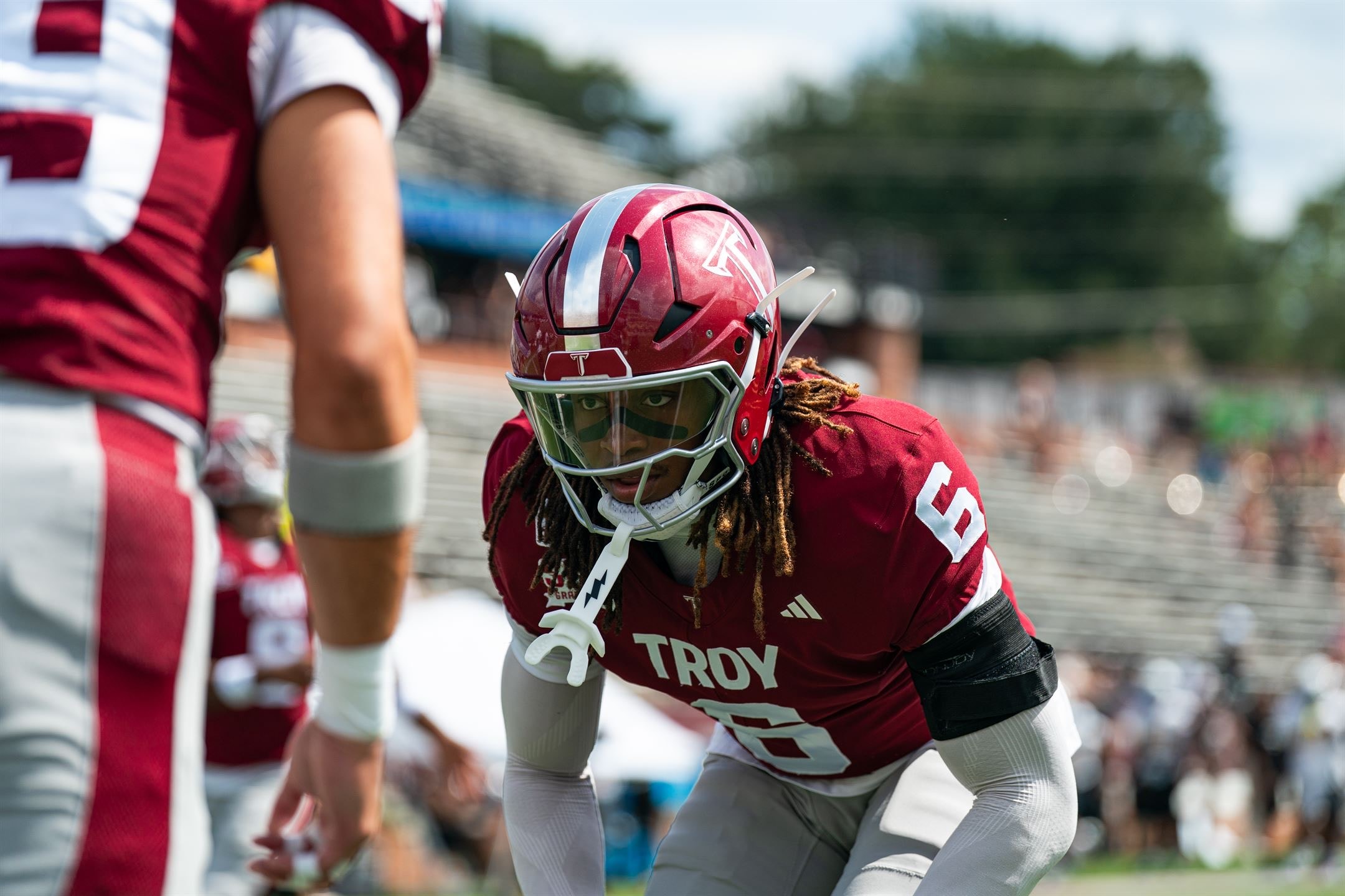 Justin Powe #6 in defensive stance at the line of scrimmage