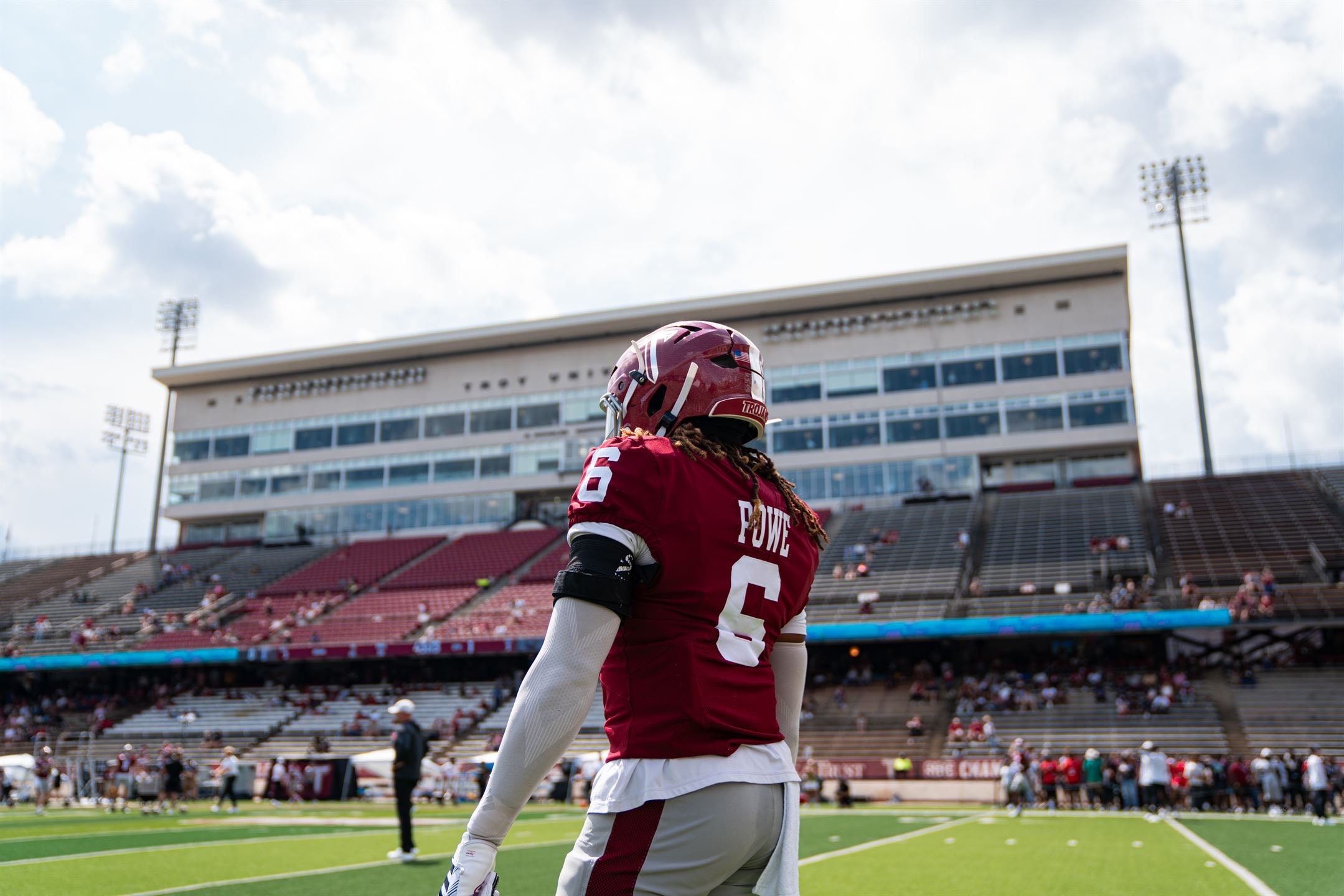 Justin Powe #6 back of jersey POWE on field at Veterans Memorial Stadium