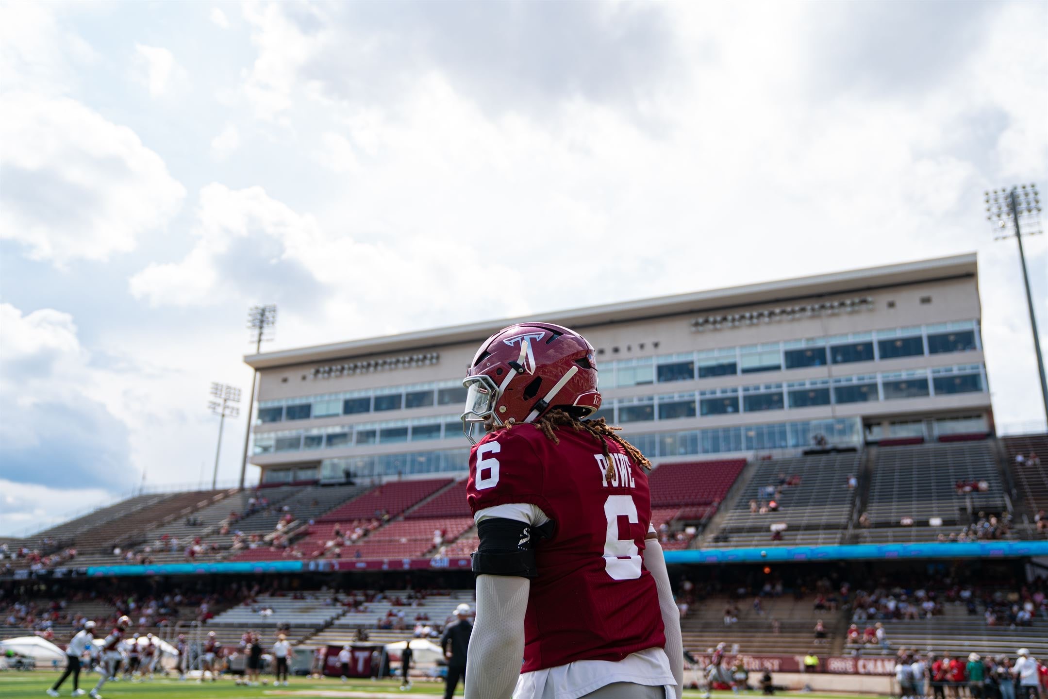 Justin Powe #6 surveying Veterans Memorial Stadium from the field