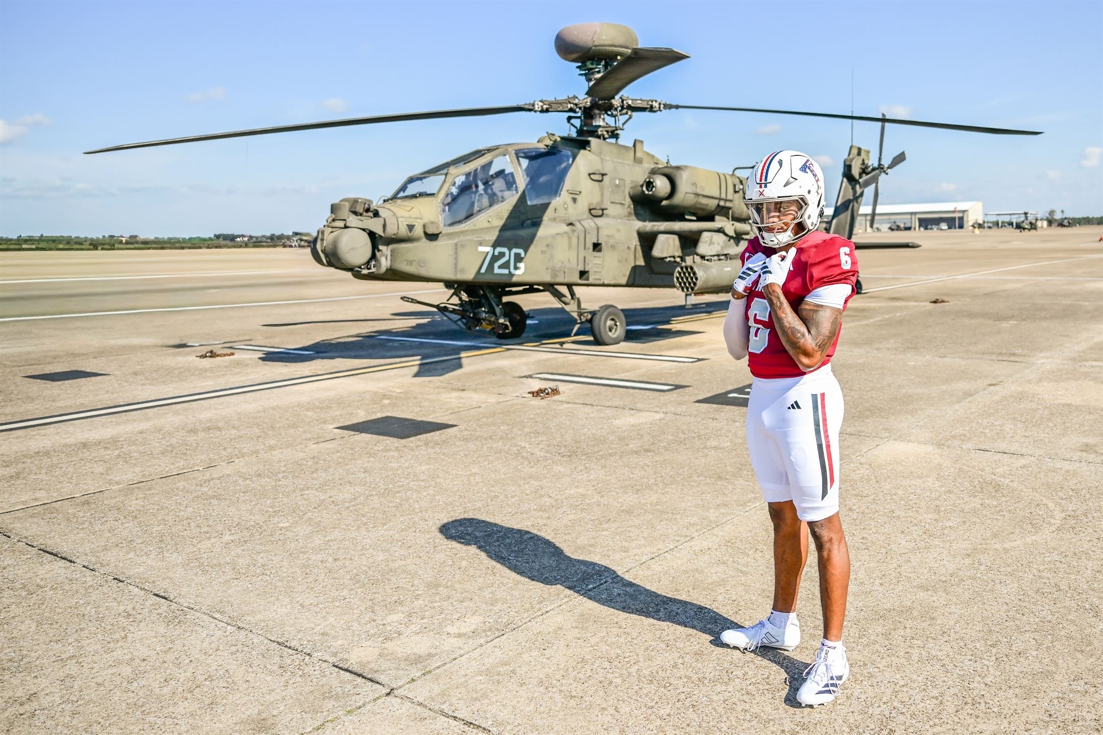 Justin Powe — full body side profile, airfield